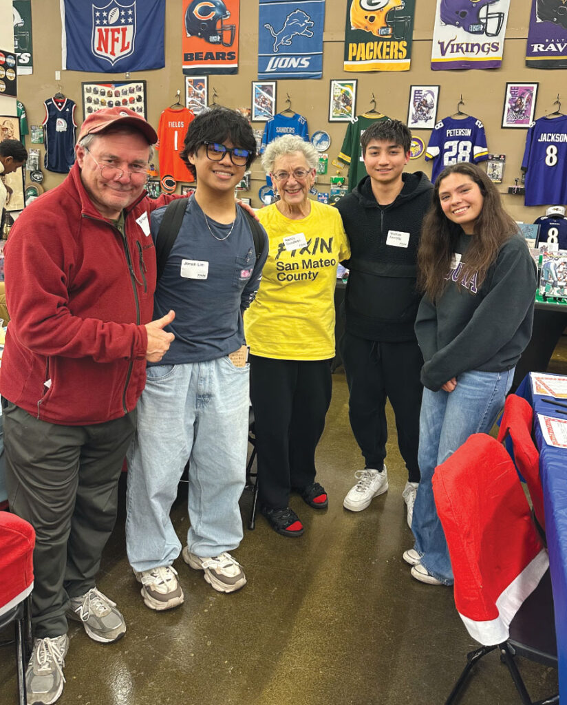 Three teen volunteers and two Fixin' regulars